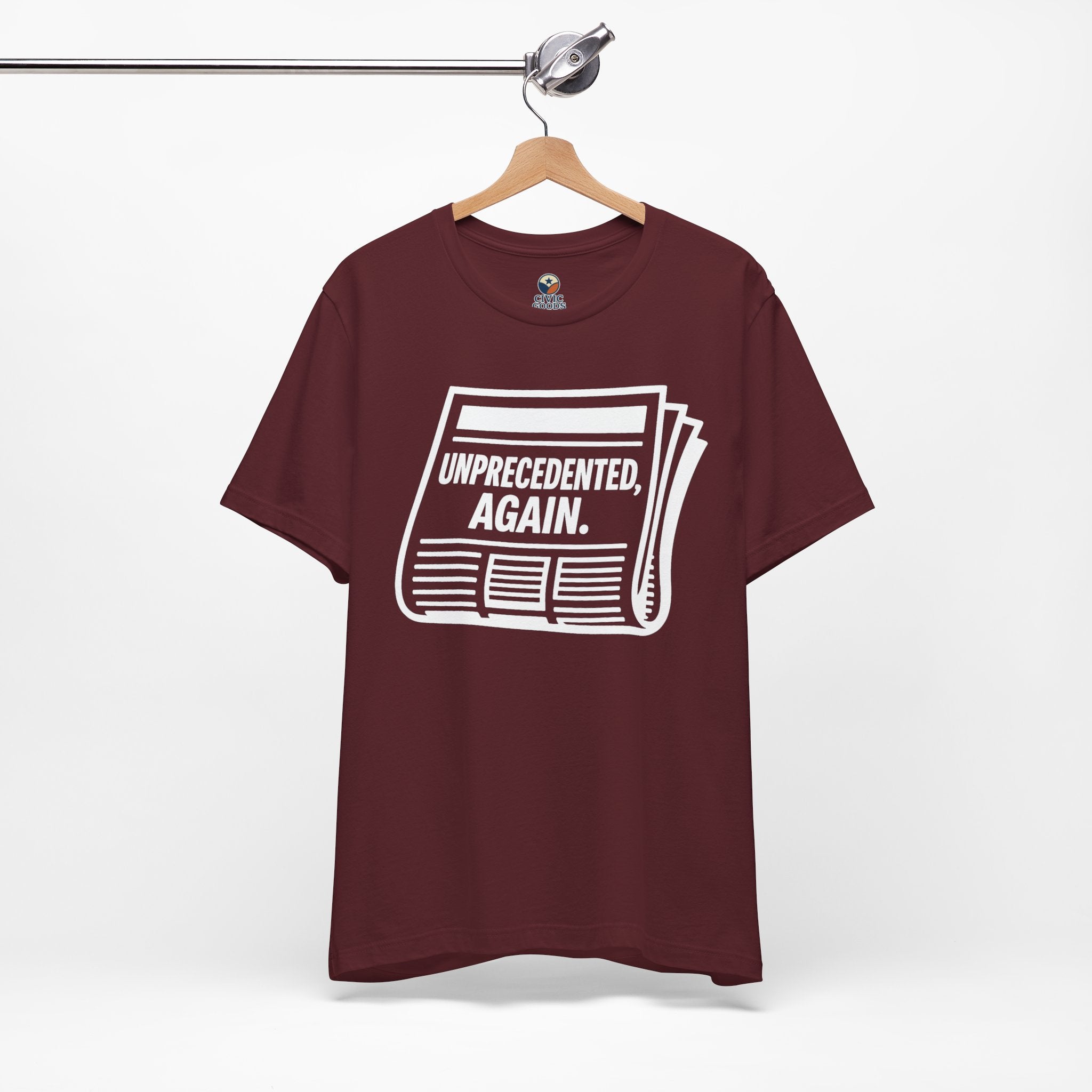 Unprecedented Again tee— Maroon  - accent — angled hanging
